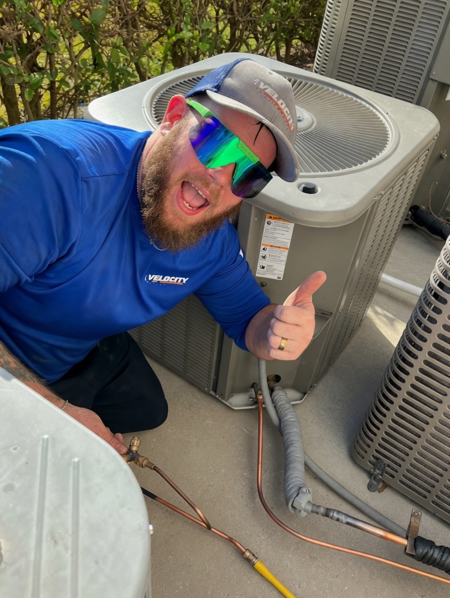 Velocity Air Conditioning technician performing AC service in Cape Coral, FL