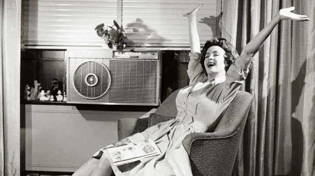 a black and white photo of a window unit air conditioner