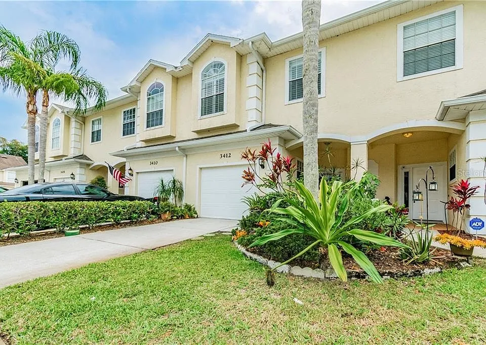 Emergency AC repair Palm Harbor technician servicing outdoor unit